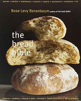 The cover of *The Bread Bible* features three crusty boules of bread stacked upon each other, the top two appear torn so that the crumb of the loaves is exposed.