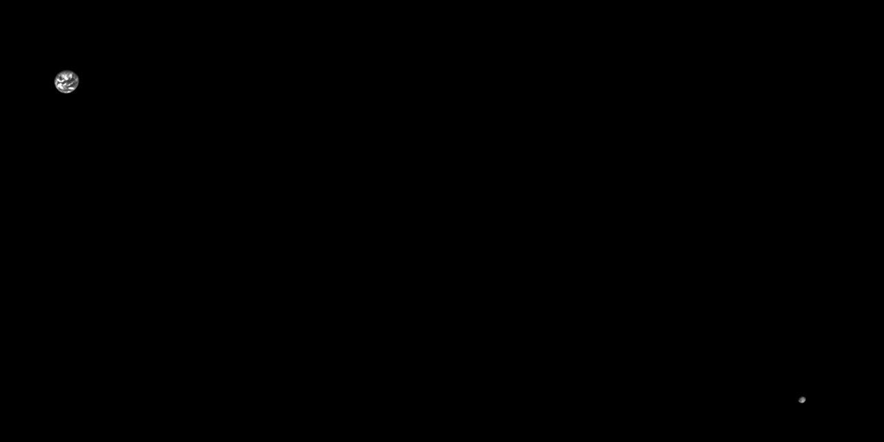 The photo is mostly a black rectangle, with two dots at opposite corners. The top-left dot, Earth, is a few times larger than the one in the bottom-right.